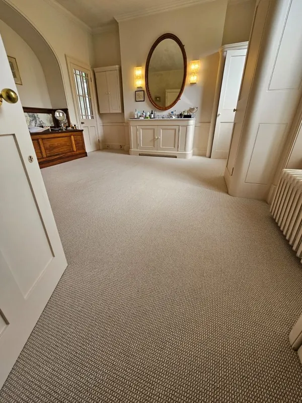 Beige sisal carpet installed in room